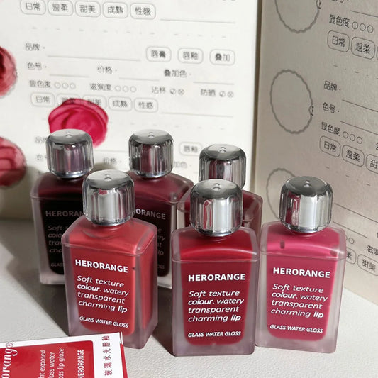 Brillo de agua de vidrio ligeramente, esmalte de labios Herorange, espejo hidratante, labios regordetes, no es fácil de pegar en la taza, maquillaje de larga duración