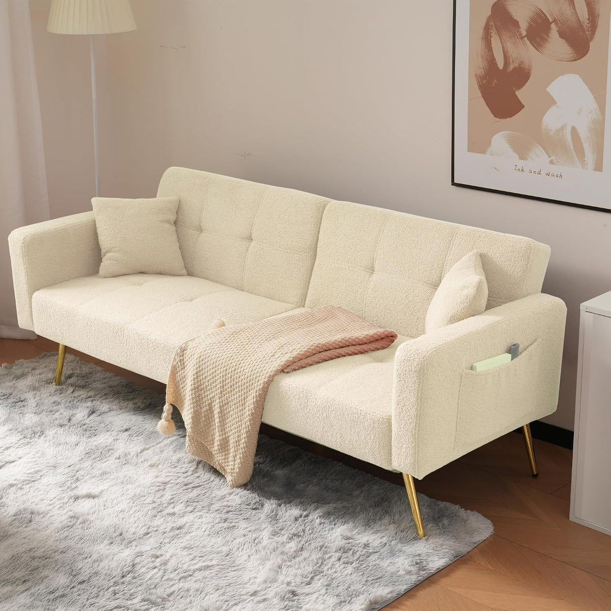 Sofá cama con esquinas ajustables, patas doradas, almohadas y bolsillos laterales para almacenamiento (Bavia)