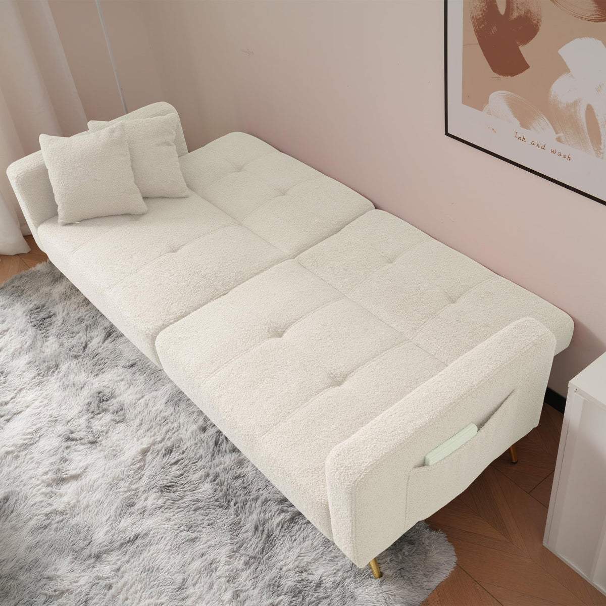 Sofá cama con esquinas ajustables, patas doradas, almohadas y bolsillos laterales para almacenamiento (Bavia)