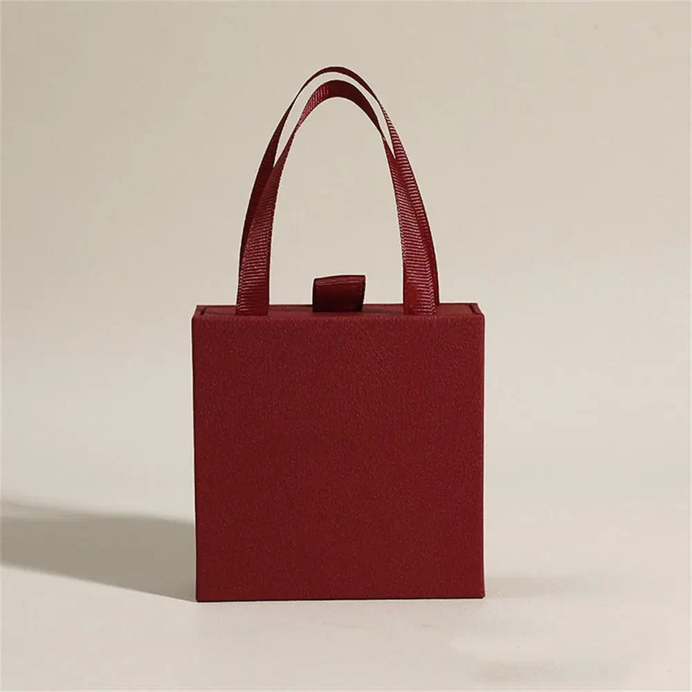 Caja de joyería tipo libro con tapa, anillo, pendientes, collar, colgante, estuche organizador, caja de embalaje de regalo de boda para el Día de San Valentín 2026