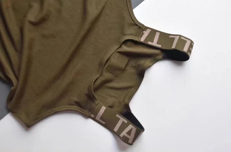 Camisetas sin mangas a la moda para hombre, chaleco deportivo de entrenamiento sin mangas, camisolas acanaladas con tirantes elásticos de Color sólido, camisetas interiores ajustadas