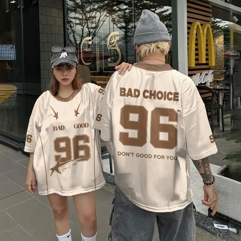 Vivodeco oversized cream short sleeve graphic shirts worn by two people outside a cafe featuring bold 96 lettering and Bad Choice text