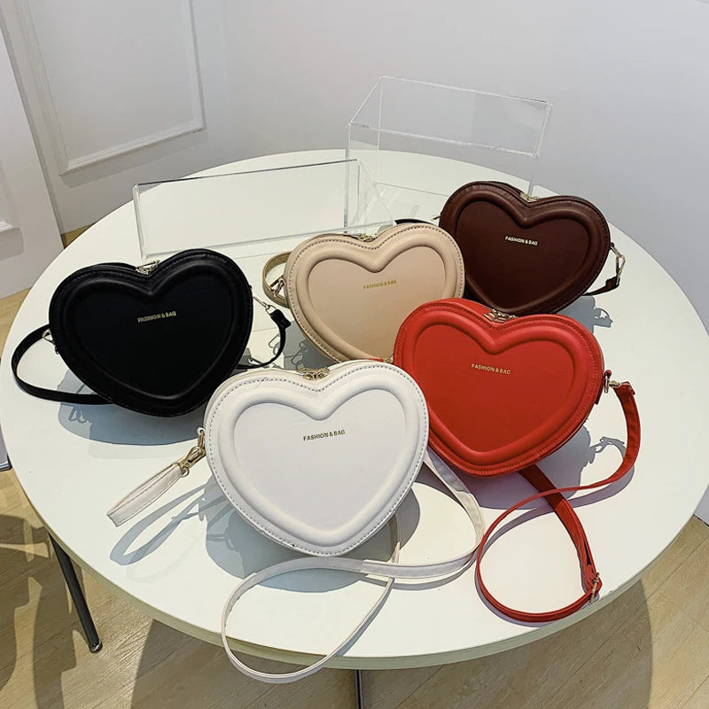 Gran oferta de bolsos cruzados con forma de corazón para mujer, bandoleras de piel sintética sólidas, bolsos de moda