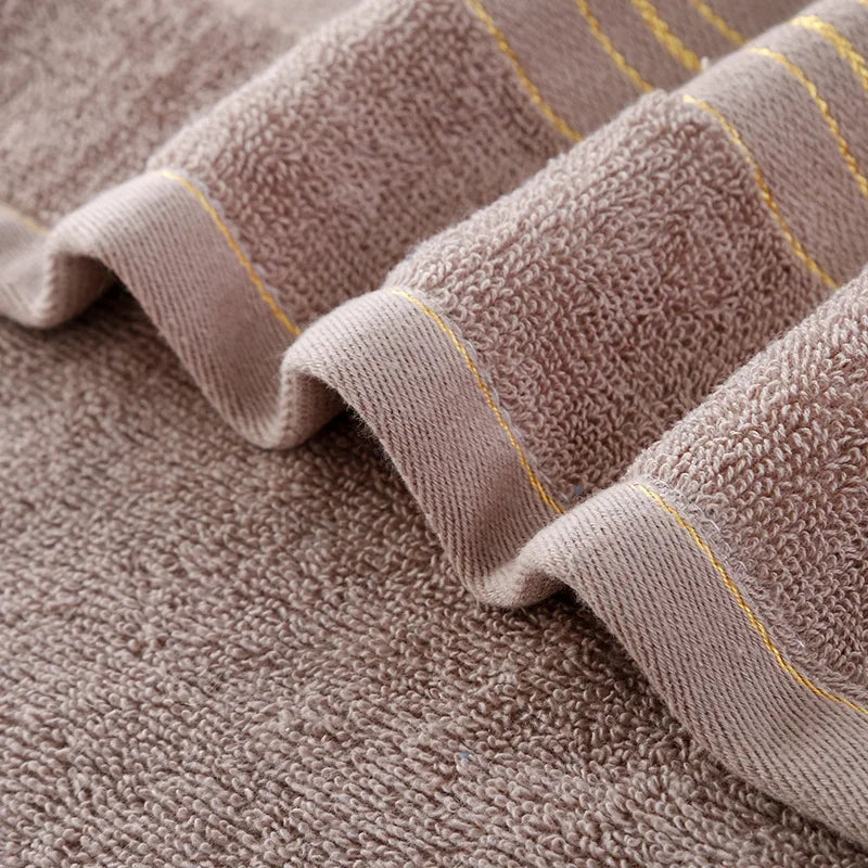 Toalla de baño de algodón grueso aumenta la absorción de agua para adultos Toalla de baño de color sólido de seda dorada Toalla de cara de afinidad suave