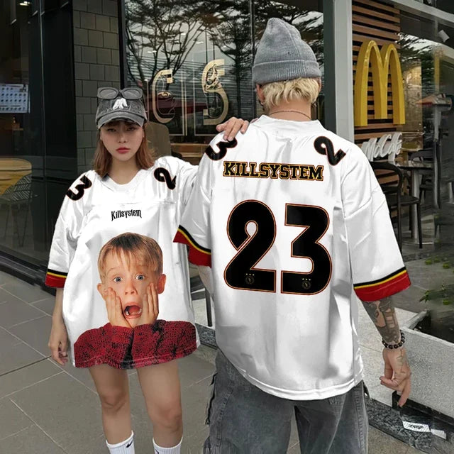 Vivodeco oversized white short sleeve shirt shown on two models with Kill System lettering a large number 23 and a humorous child graphic on the front