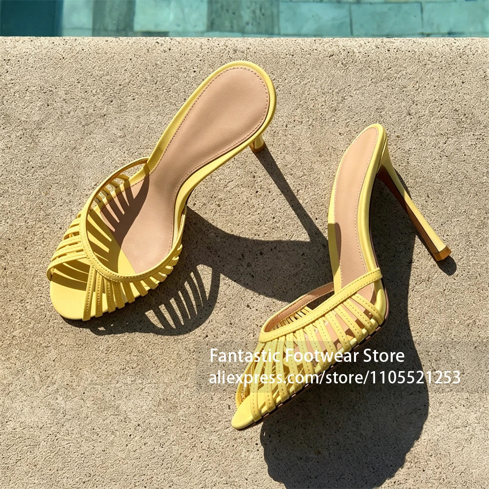 Vivodeco yellow slip-on sandals with narrow straps, open toes, and high stiletto heels displayed on sunlit concrete.