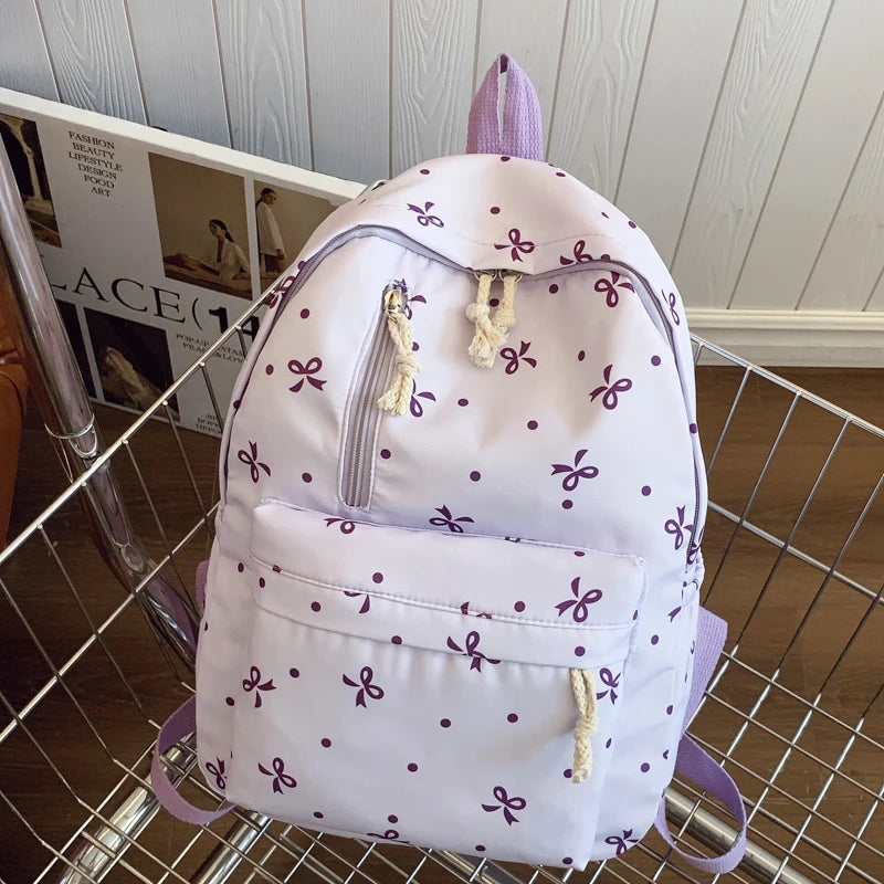 Para uso diario, temporada de regreso a la escuela, mochila acolchada con estampado de lazos divertidos, con múltiples bolsillos, correas ajustables, gran capacidad