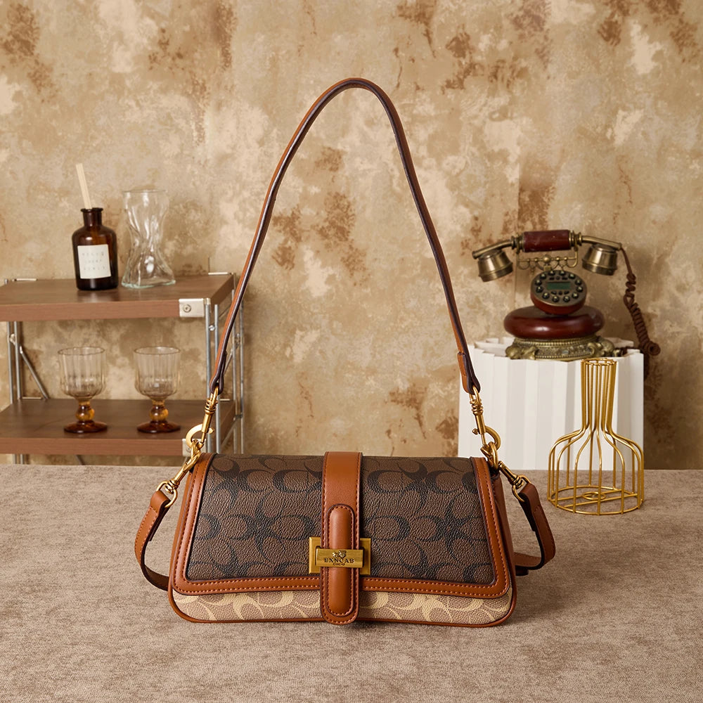 Bolso de mano para mujer 2026, nuevo diseño de nicho a la moda, bolso retro de hombro, ideal para el día a día, con bandolera de lujo ligero de alta gama.