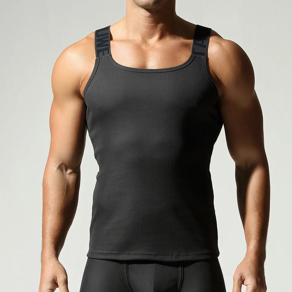 Camisetas sin mangas a la moda para hombre, chaleco deportivo de entrenamiento sin mangas, camisolas acanaladas con tirantes elásticos de Color sólido, camisetas interiores ajustadas