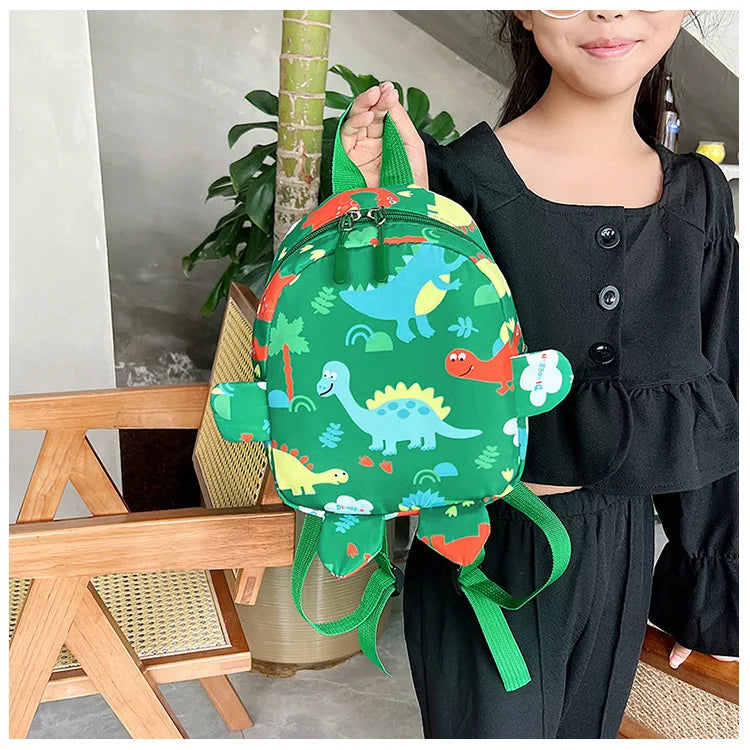 Bolsa bonita para niños, mochilas escolares con dibujos de dinosaurios para niños, mochila de viaje para exteriores preescolar para guardería, antipérdida