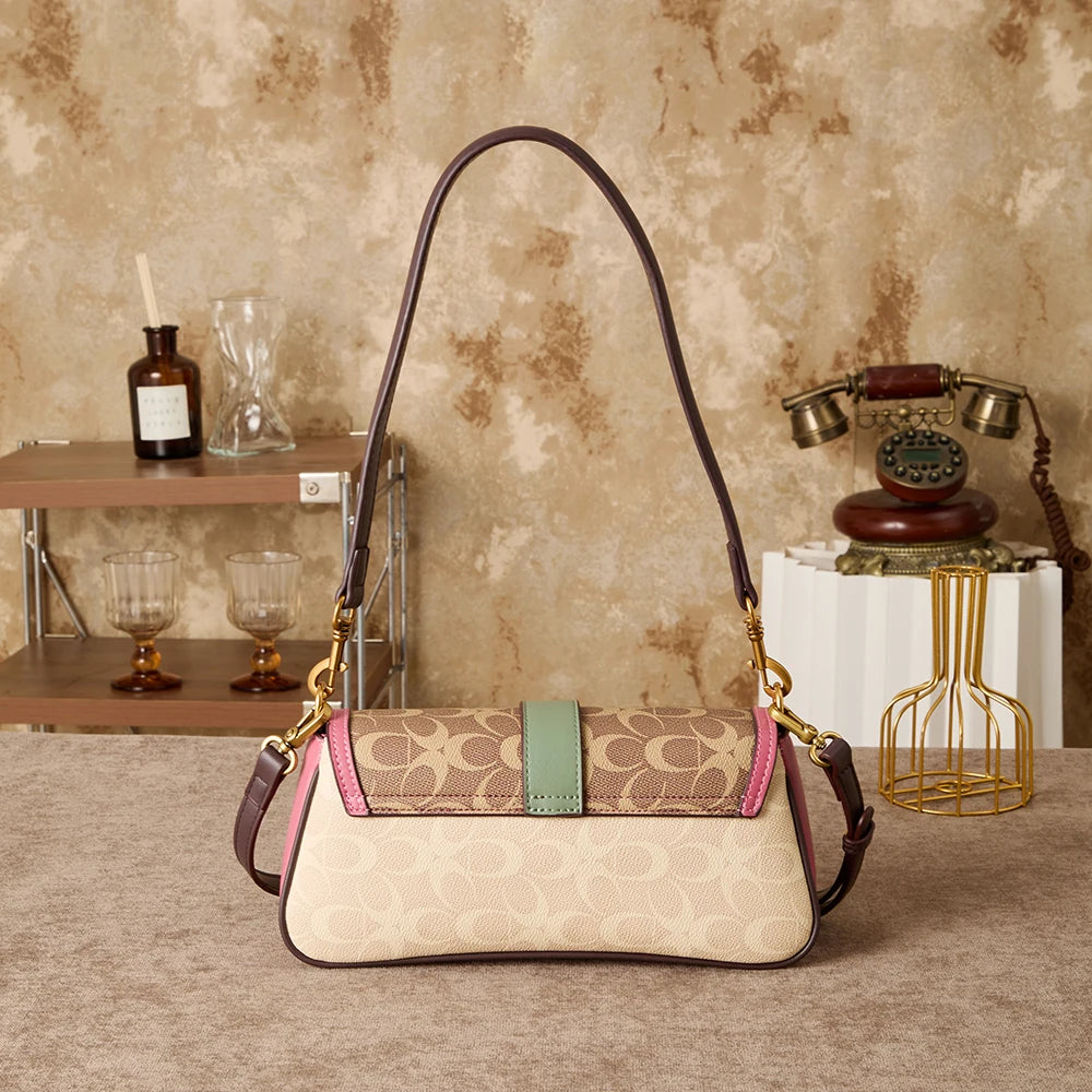 Bolso de mano para mujer 2026, nuevo diseño de nicho a la moda, bolso retro de hombro, ideal para el día a día, con bandolera de lujo ligero de alta gama.