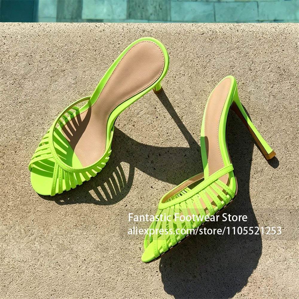 Vivodeco lime green women's mules with narrow strappy uppers, open rounded toes, tan insoles, and slim stiletto heels displayed on sunlit pavement.
