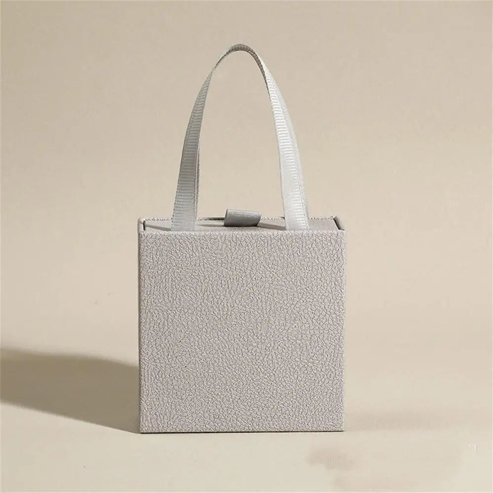 Caja de joyería tipo libro con tapa, anillo, pendientes, collar, colgante, estuche organizador, caja de embalaje de regalo de boda para el Día de San Valentín 2026