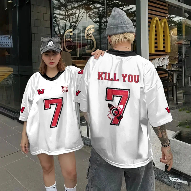 Vivodeco oversized white short sleeve shirts worn by two people, featuring bold red number 7 graphics, contrasting lettering, and casual streetwear styling outside a cafe