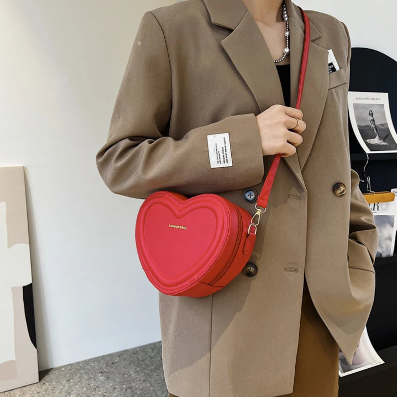 Gran oferta de bolsos cruzados con forma de corazón para mujer, bandoleras de piel sintética sólidas, bolsos de moda