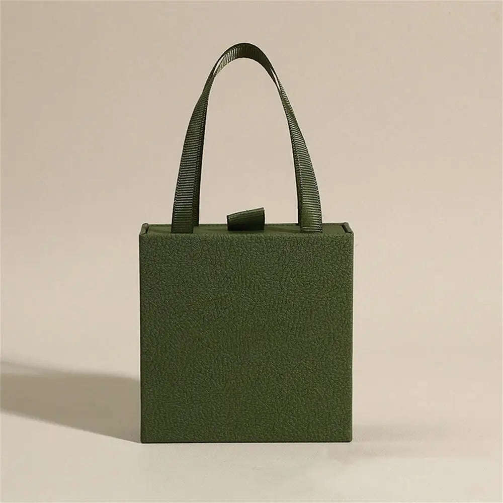 Caja de joyería tipo libro con tapa, anillo, pendientes, collar, colgante, estuche organizador, caja de embalaje de regalo de boda para el Día de San Valentín 2026